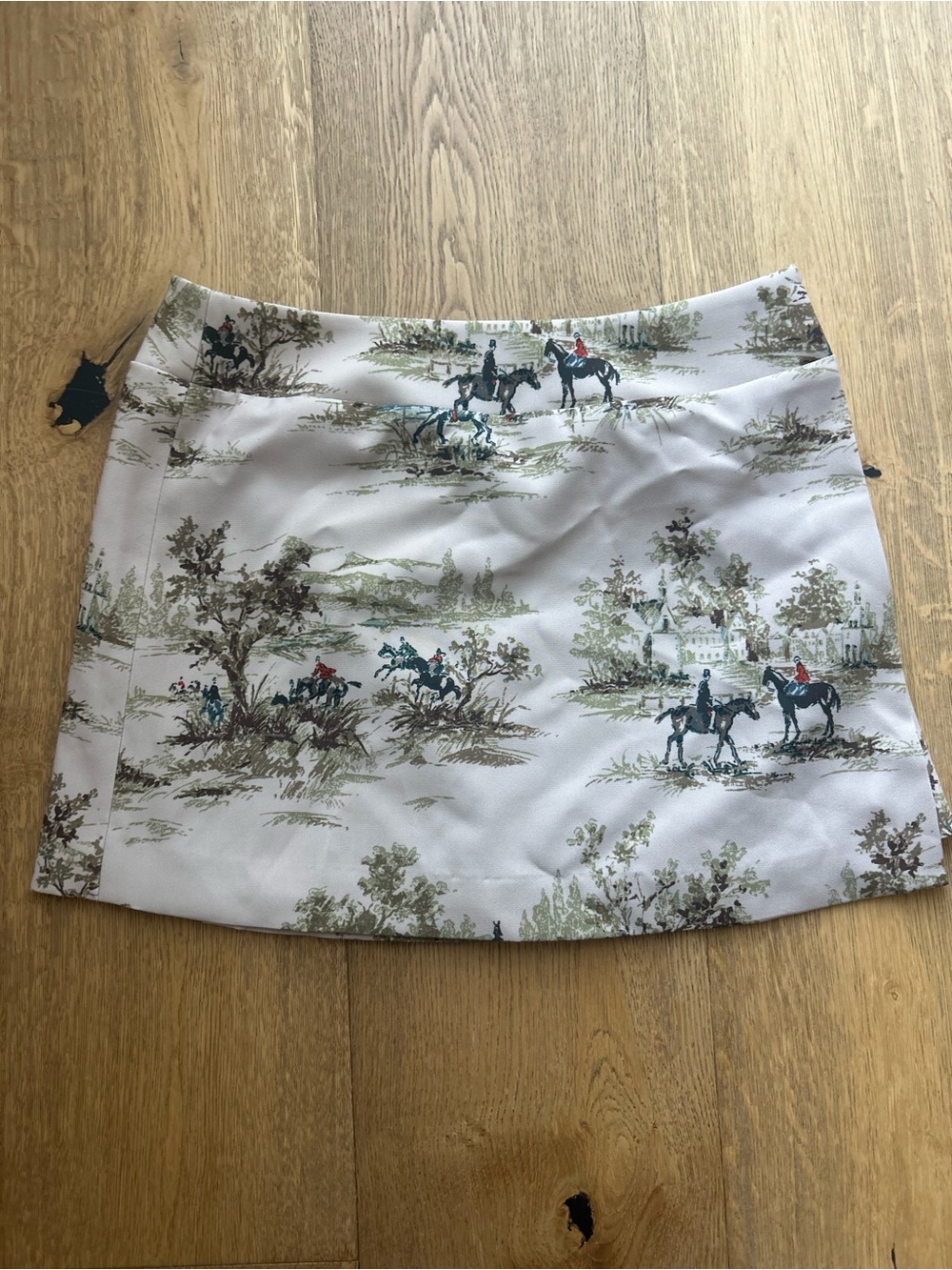 Hill House Mini Skirt in White with Green and Brown Riding Print